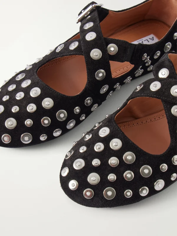 Close-up detail of the Alaïa Criss Cross Embellished Suede Ballet Flats