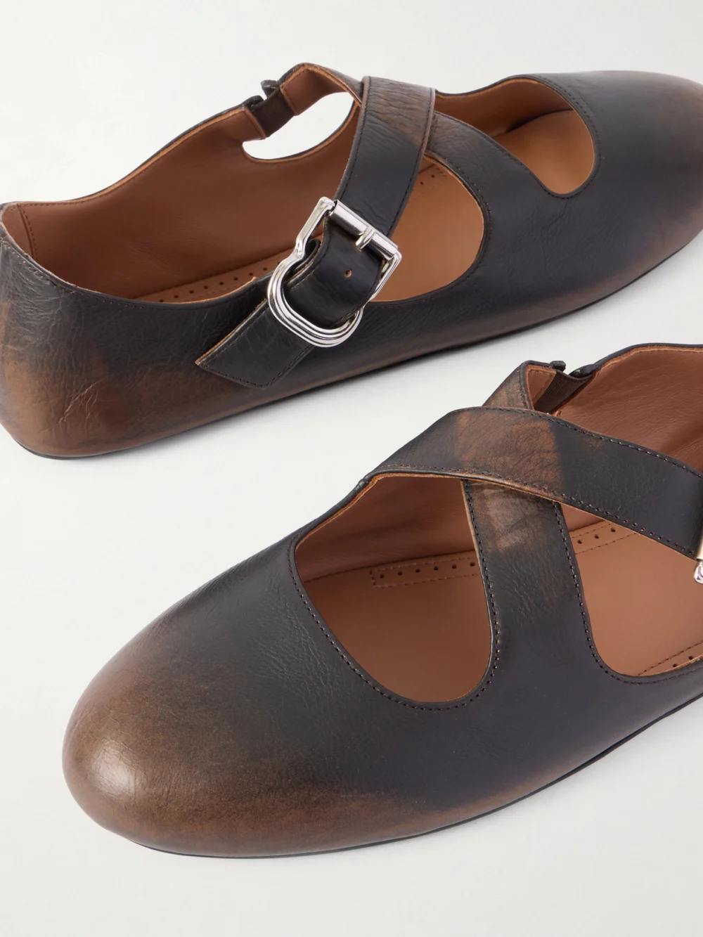 Close-up detail of the Alaïa Criss Cross Leather Ballet Flats