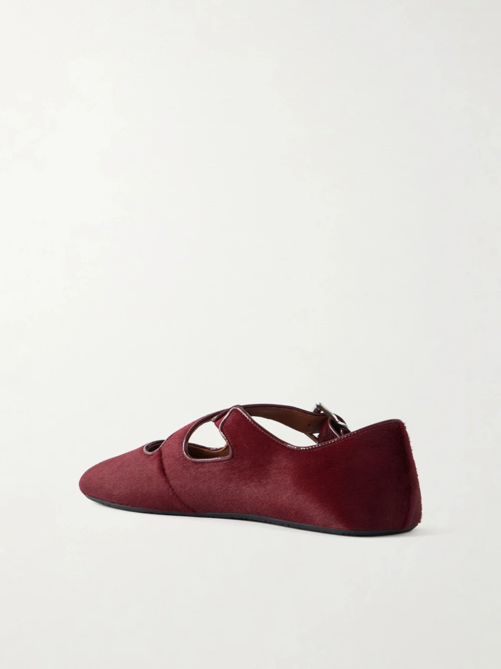 Back view of the Alaïa Criss Cross Leather-trimmed Calf Hair Ballet Flats