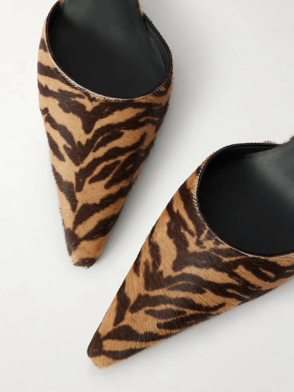 Close-up detail of the Alaïa D'orsay 110 Tiger-print Calf Hair Pumps
