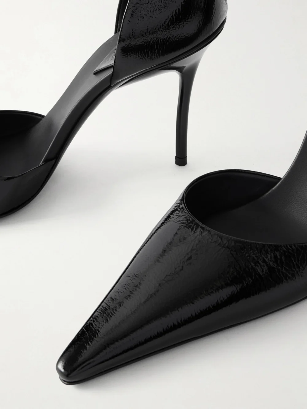 Close-up detail of the Alaïa D'orsay 90 Glossed Textured-leather Pumps