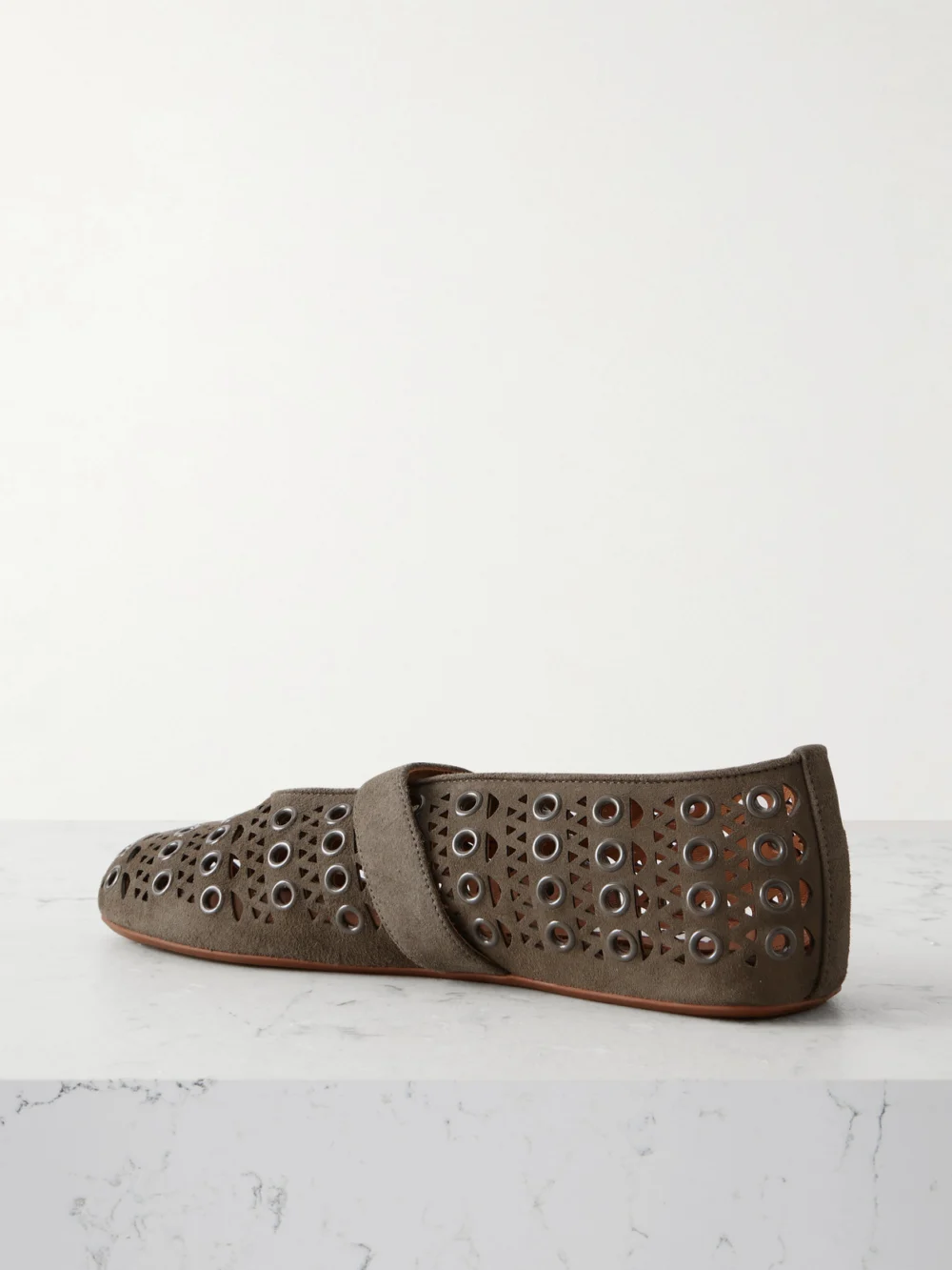Back view of the Alaïa Eyelet-embellished Perforated Suede Ballet Flats