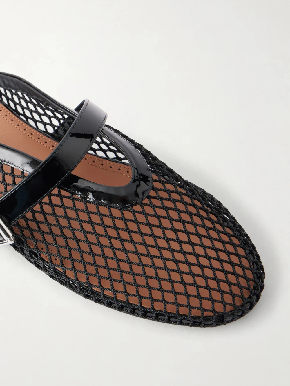 Close-up detail of the Alaïa Fishnet Flat Mules