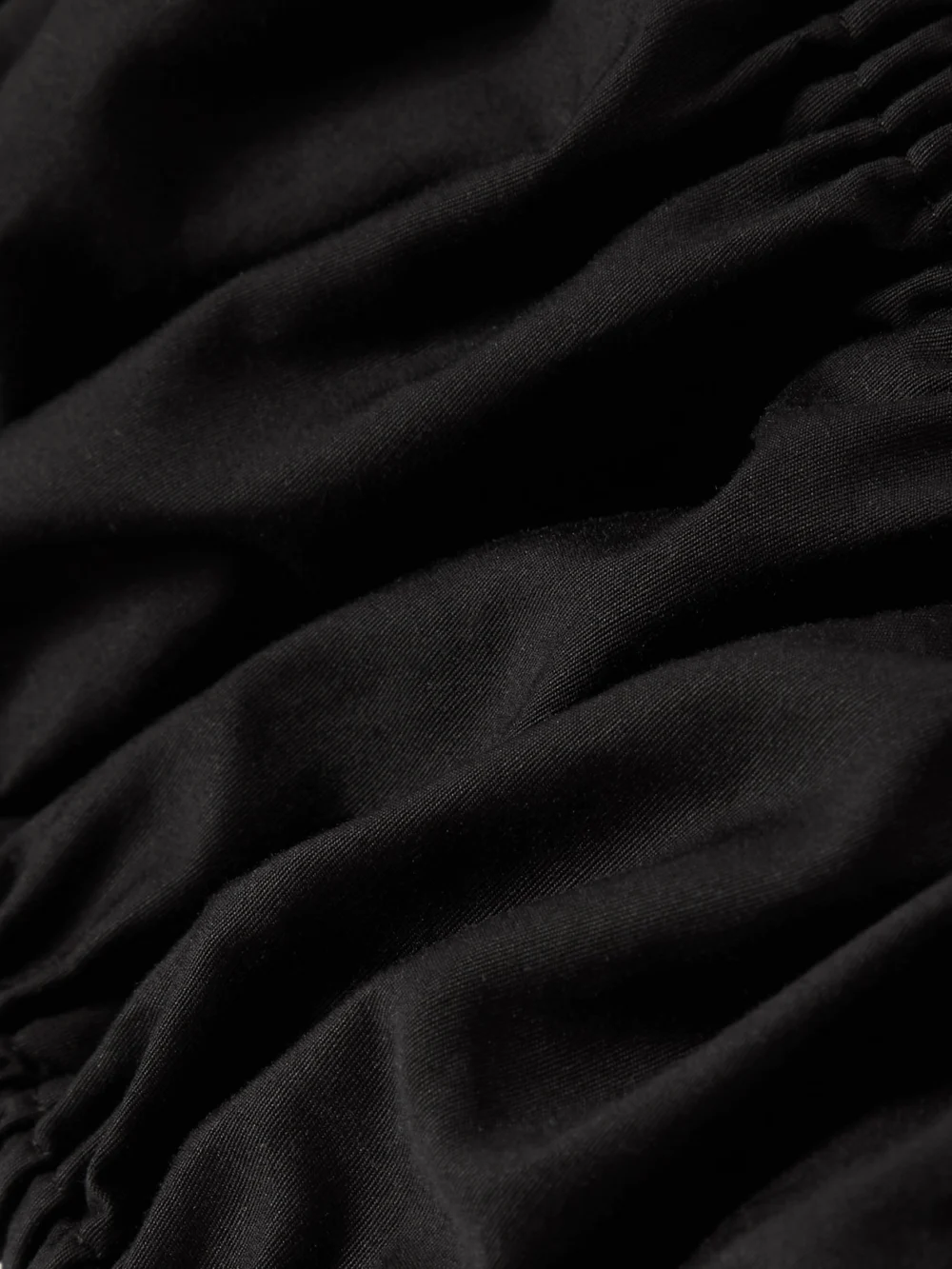 Close-up detail of the Alaïa Gathered Cotton-poplin Bralette