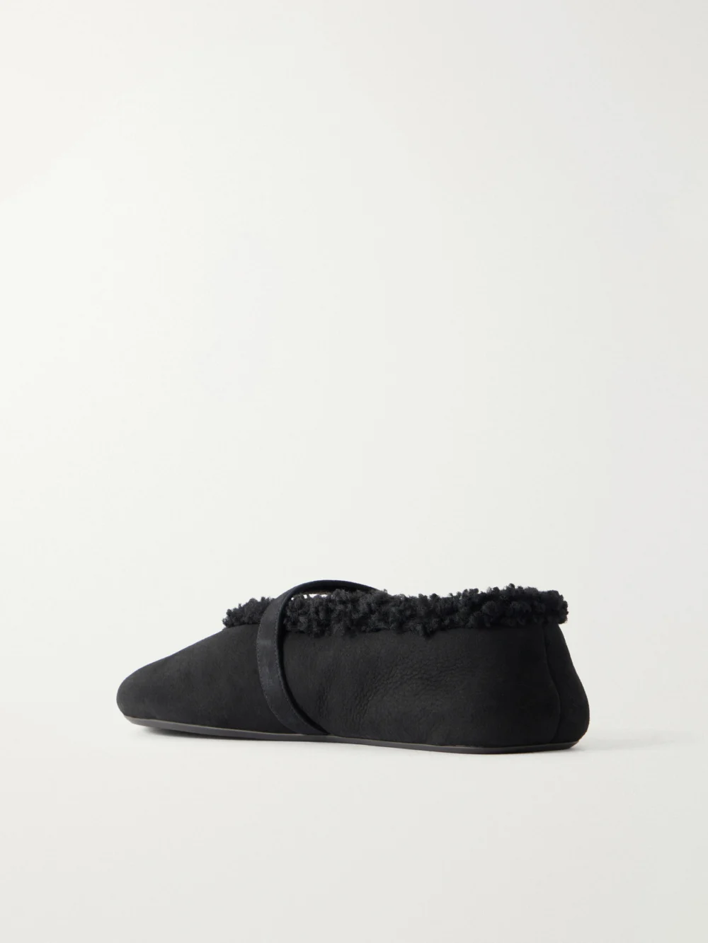 Back view of the Alaïa La Ballerine Shearling-trimmed Suede Ballet Flats