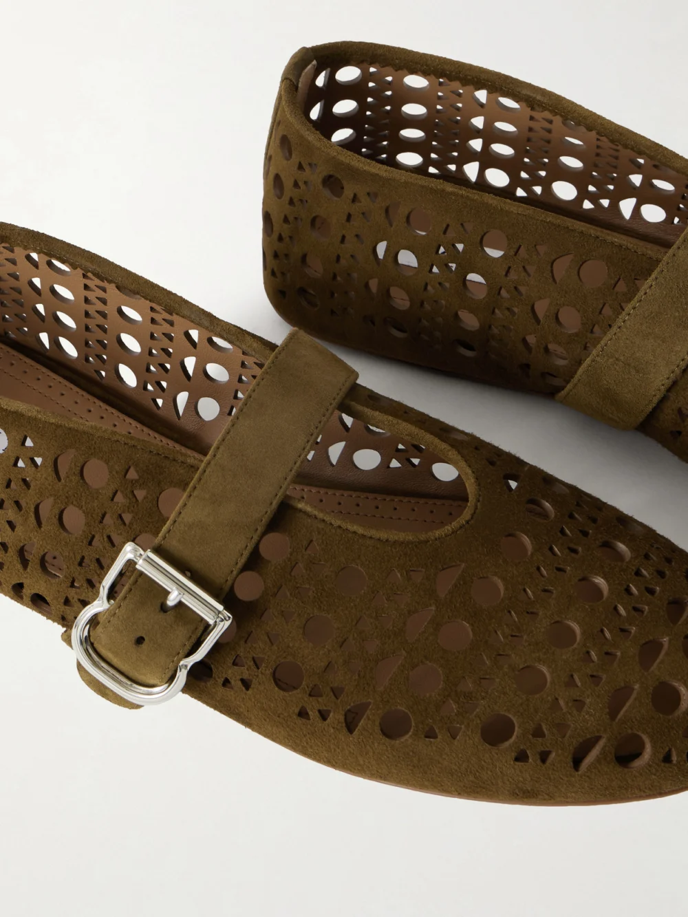 Close-up detail of the Alaïa Laser-cut Suede Ballet Flats