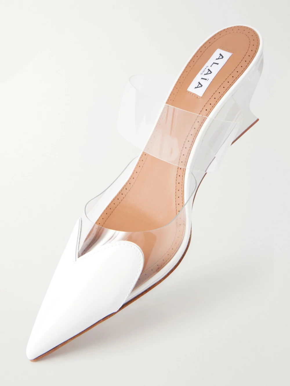 Close-up detail of the Alaïa Le Caur 60 Patent-leather and Pvc Wedge Mules