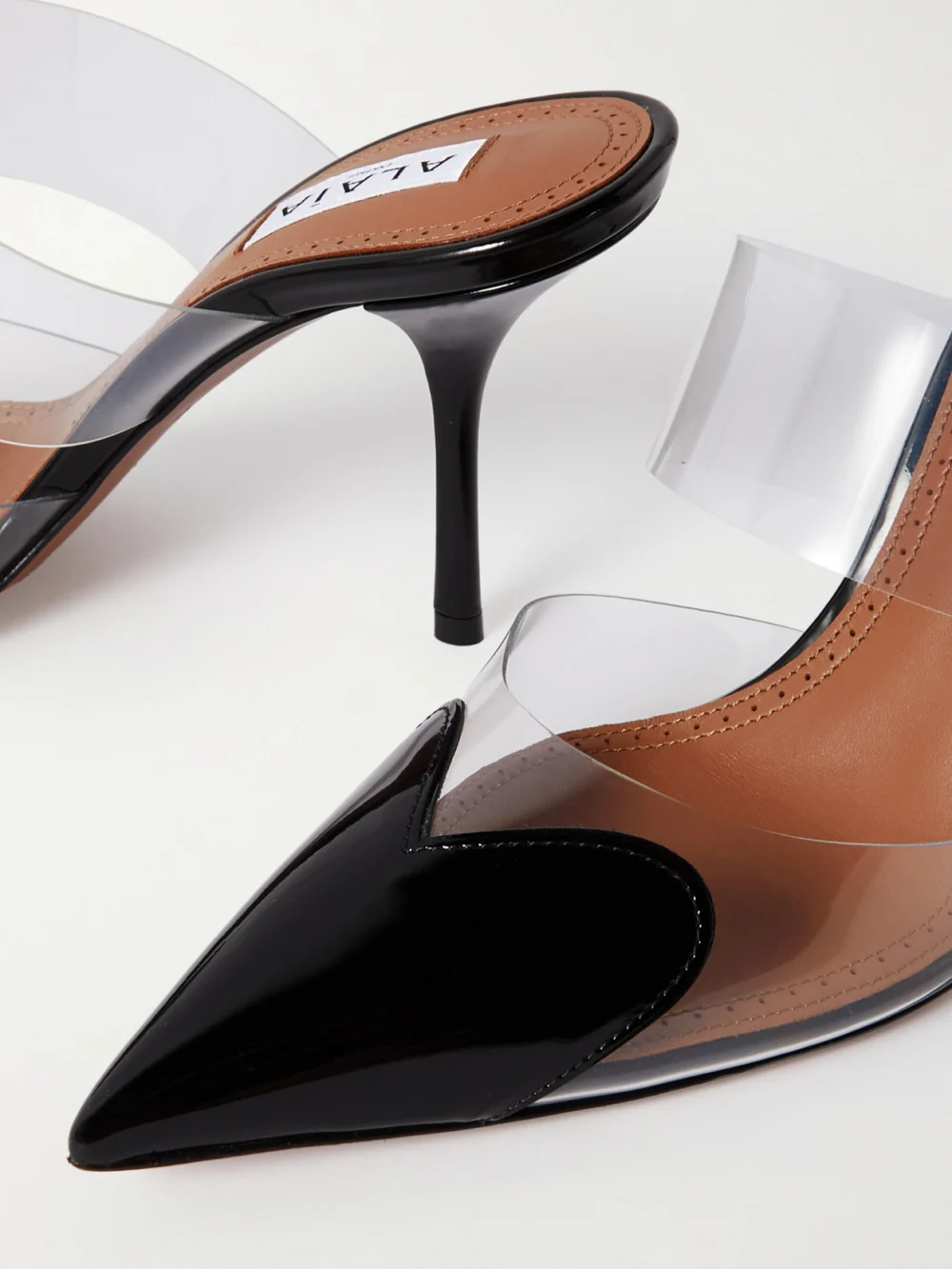 Close-up detail of the Alaïa Le Caur 90 Pu and Patent-leather Mules