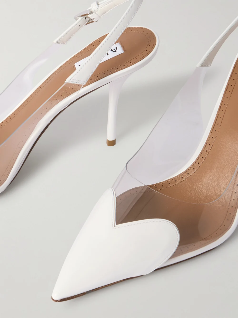 Close-up detail of the Alaïa Le Caur Leather and Pvc Slingback Pumps