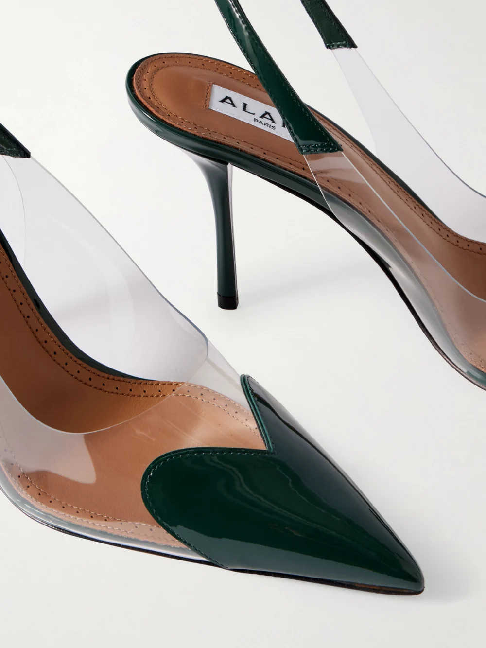 Close-up detail of the Alaïa Le Caur Patent-leather and Pvc Slingback Pumps