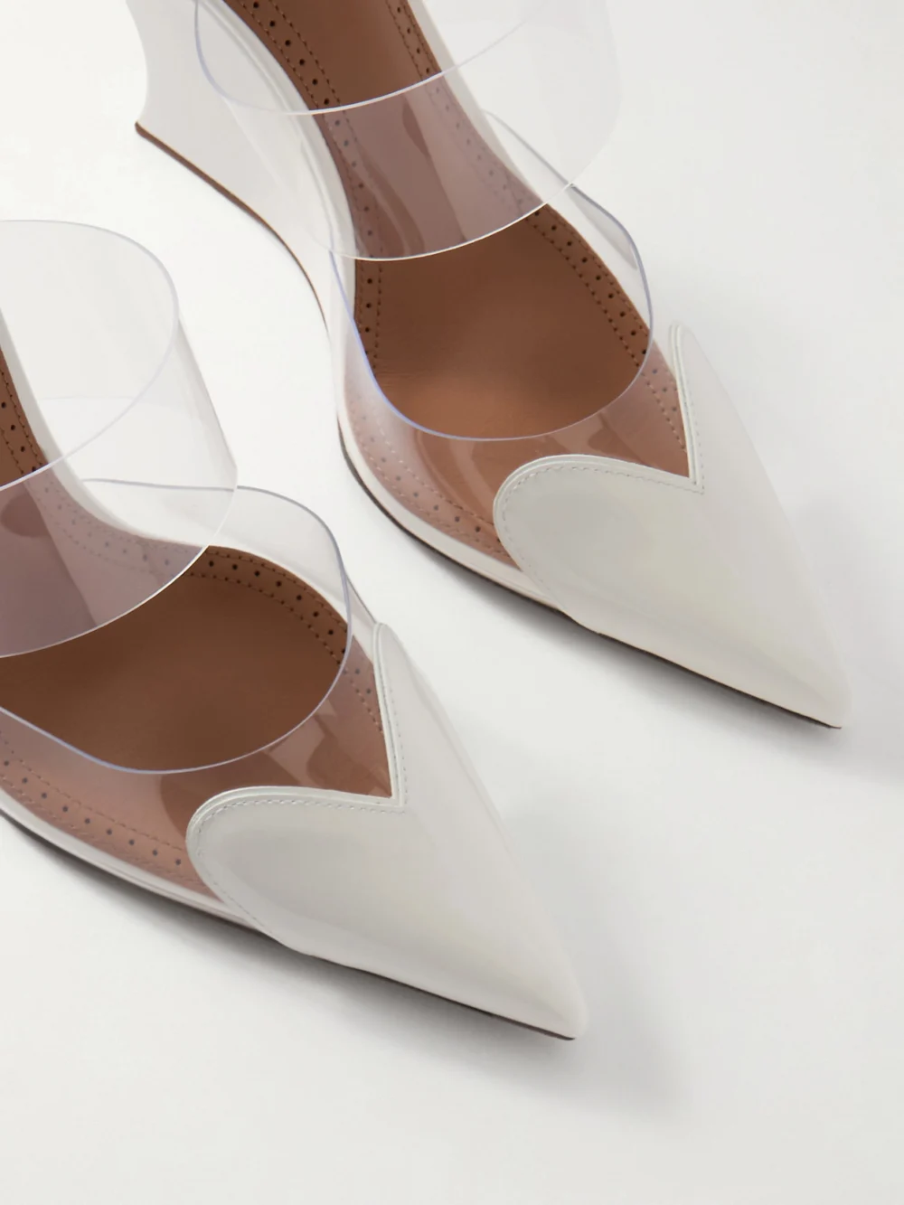 Close-up detail of the Alaïa Le Caur Patent-leather and Pvc Wedge Mules