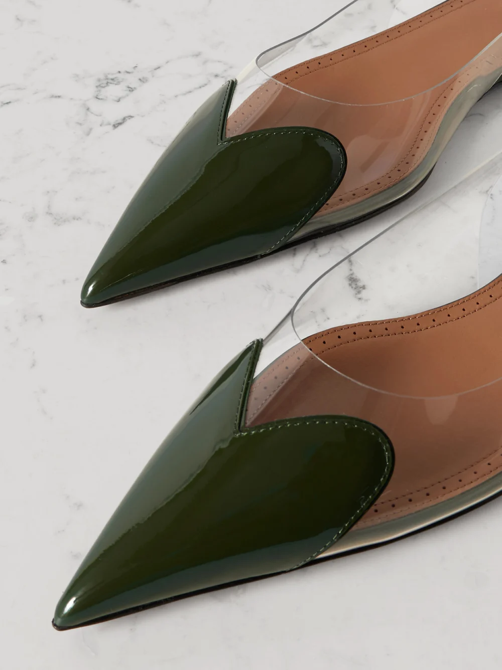 Close-up detail of the Alaïa Le Caur Pu and Patent-leather Slingback Point-toe Flats
