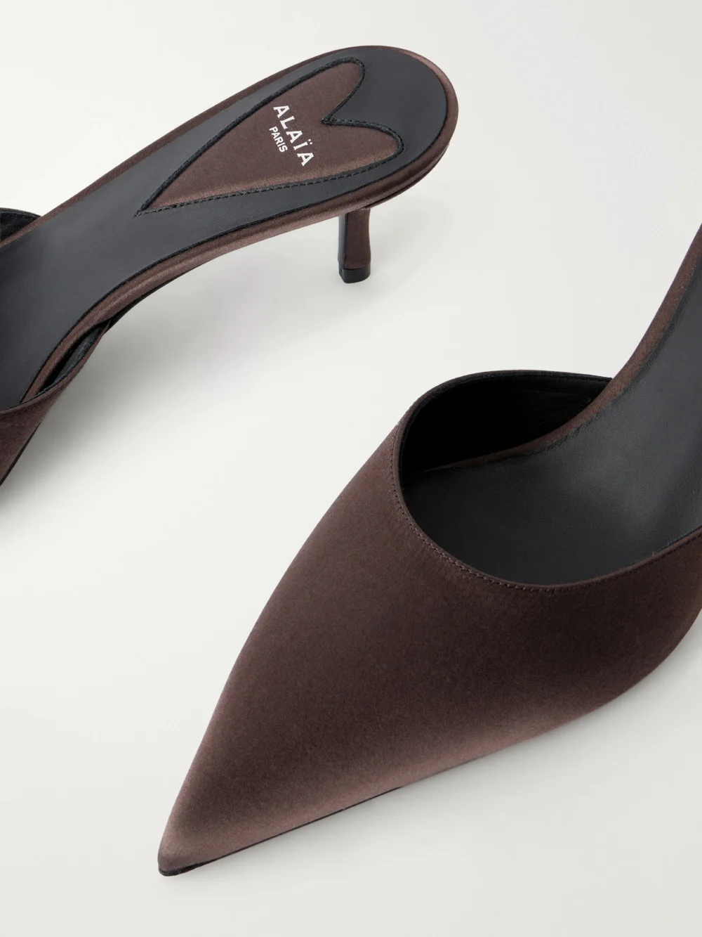 Close-up detail of the Alaïa Le Coeur 55 Satin Mules