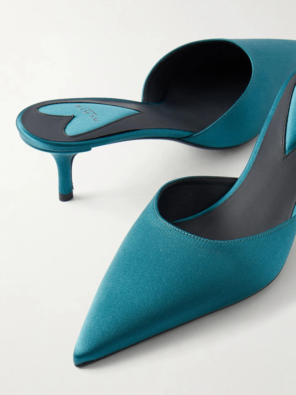 Close-up detail of the Alaïa Le Coeur 55 Satin Mules