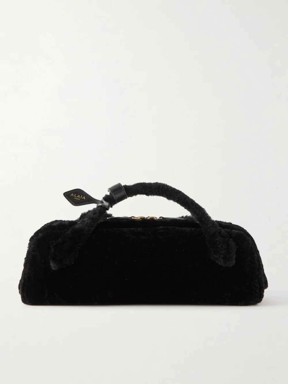 Alaïa Le Teckel Leather-trimmed Shearling Clutch in black