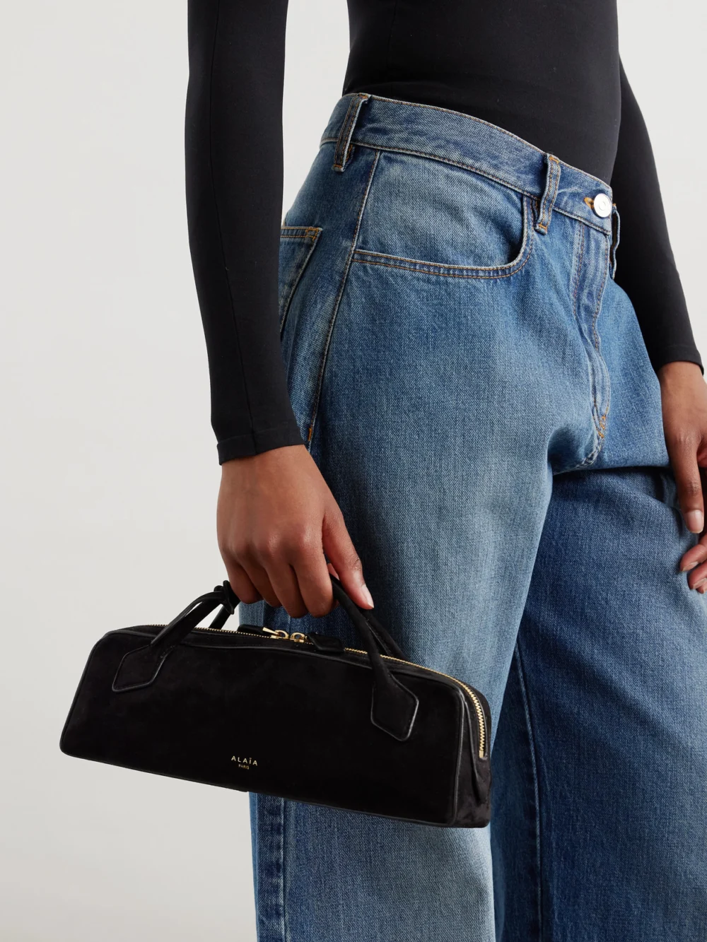 Alaïa Le Teckel Leather-trimmed Suede Clutch, styled view