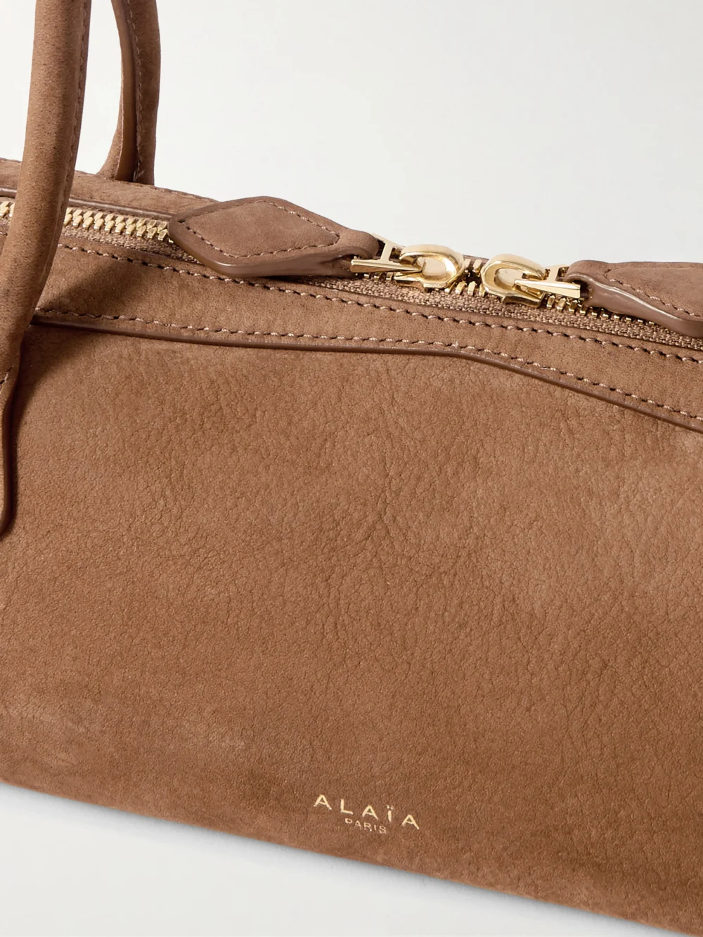 Close-up detail of the Alaïa Le Teckel Medium Nubuck Shoulder Bag