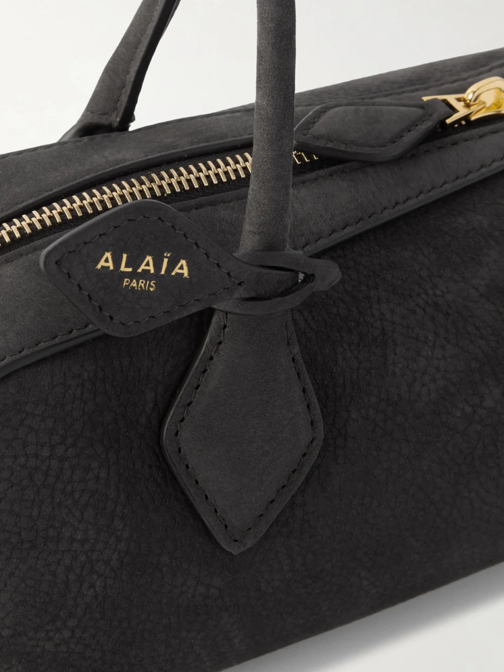 Close-up detail of the Alaïa Le Teckel Medium Nubuck Shoulder Bag