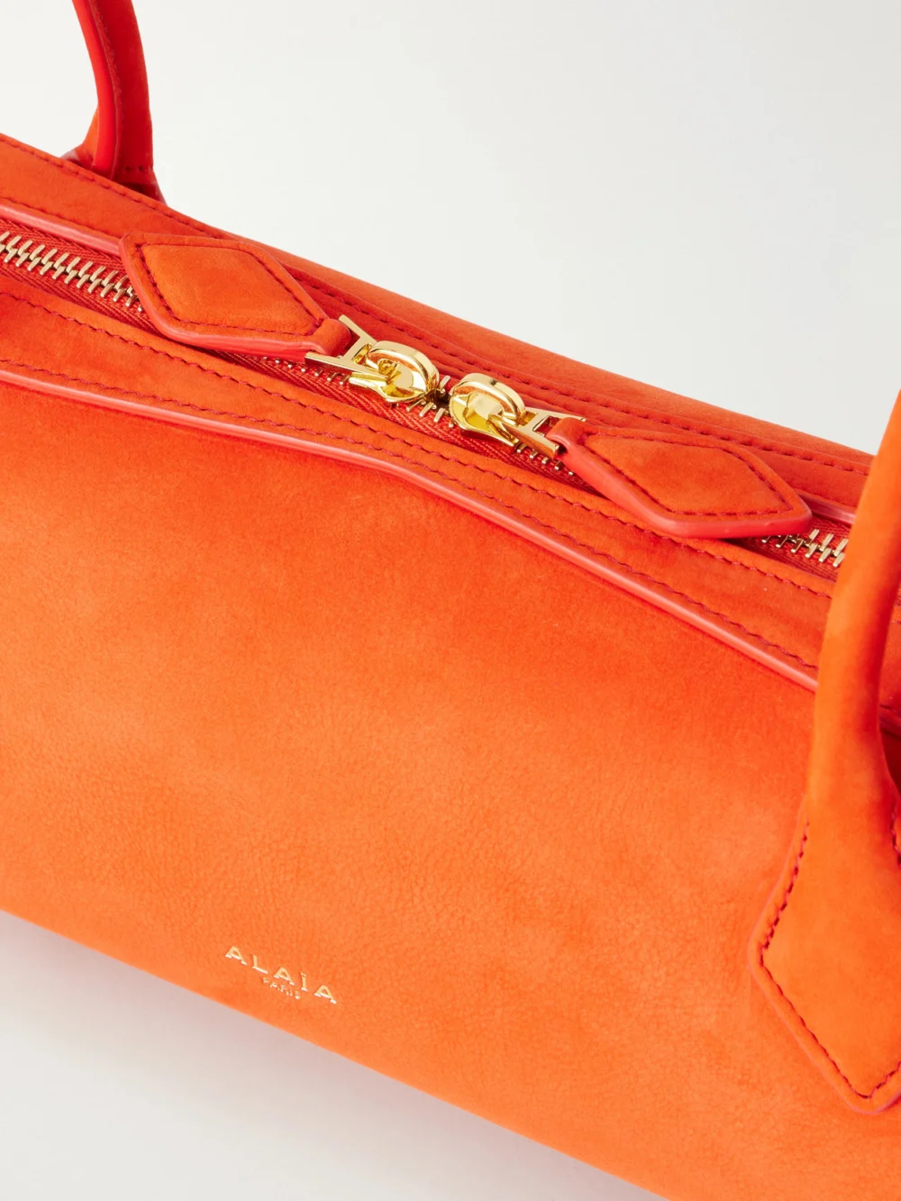 Close-up detail of the Alaïa Le Teckel Medium Nubuck Shoulder Bag