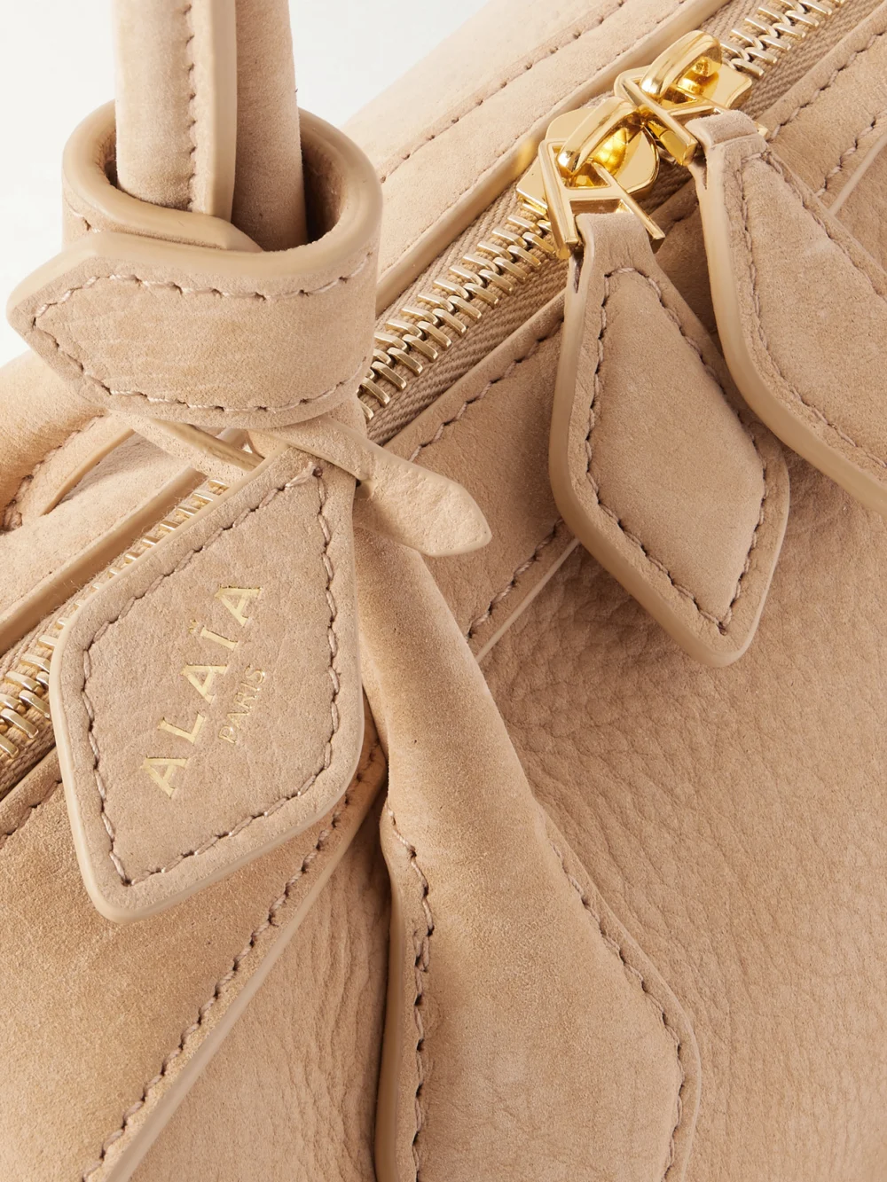 Close-up detail of the Alaïa Le Teckel Medium Nubuck Shoulder Bag