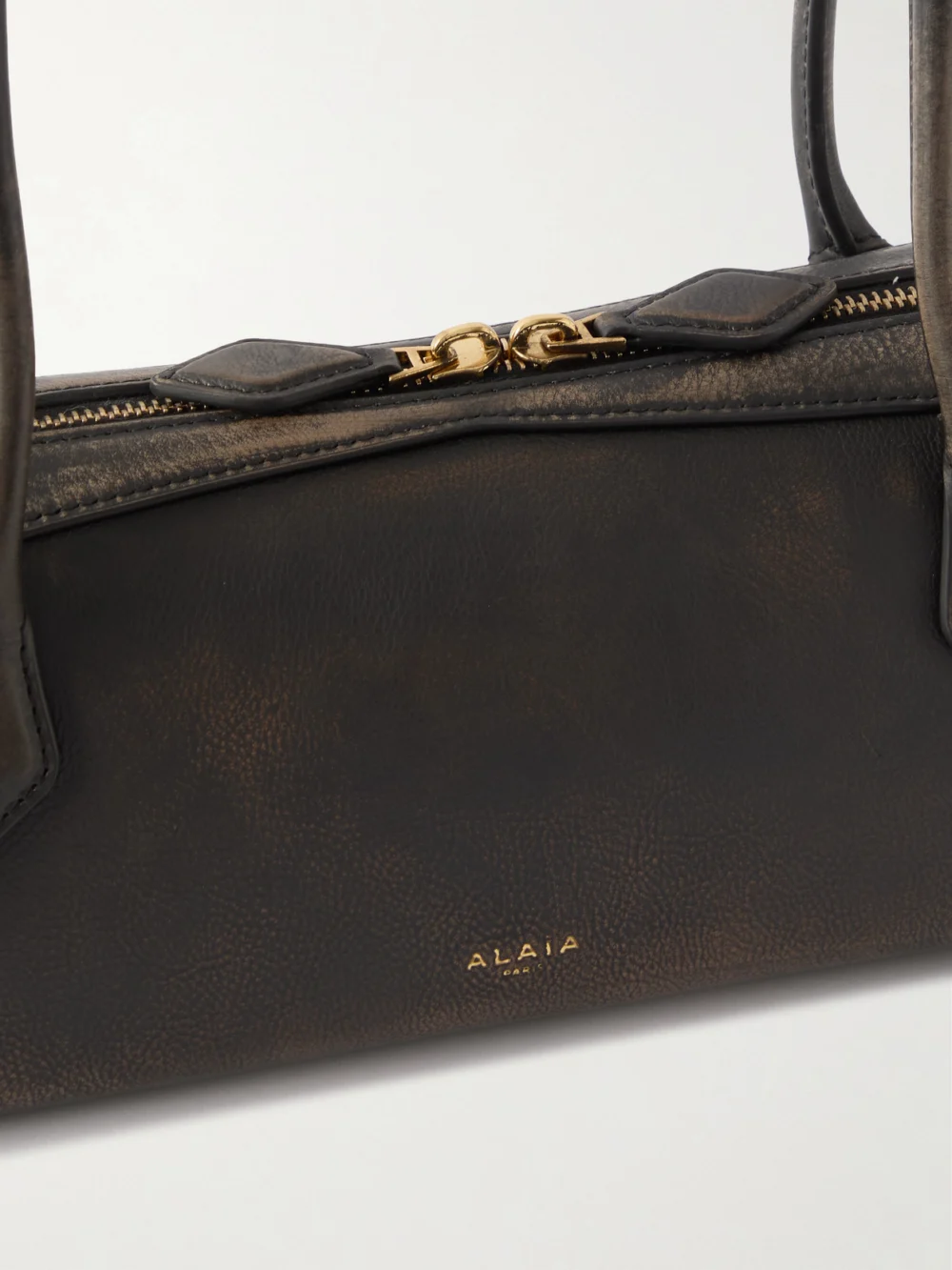 Close-up detail of the Alaïa Le Teckel Medium Textured-leather Shoulder Bag