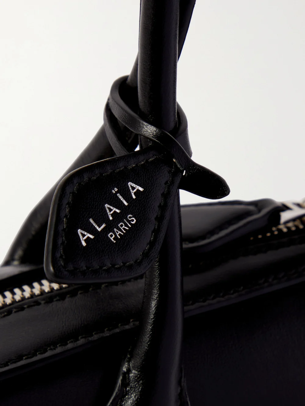 Close-up detail of the Alaïa Le Teckel Small Leather Shoulder Bag