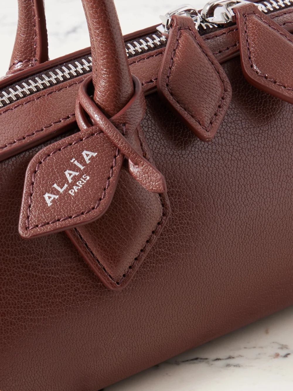 Close-up detail of the Alaïa Le Teckel Small Leather Shoulder Bag