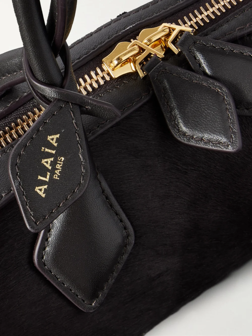 Close-up detail of the Alaïa Le Teckel Small Leather-trimmed Calf Hair Shoulder Bag