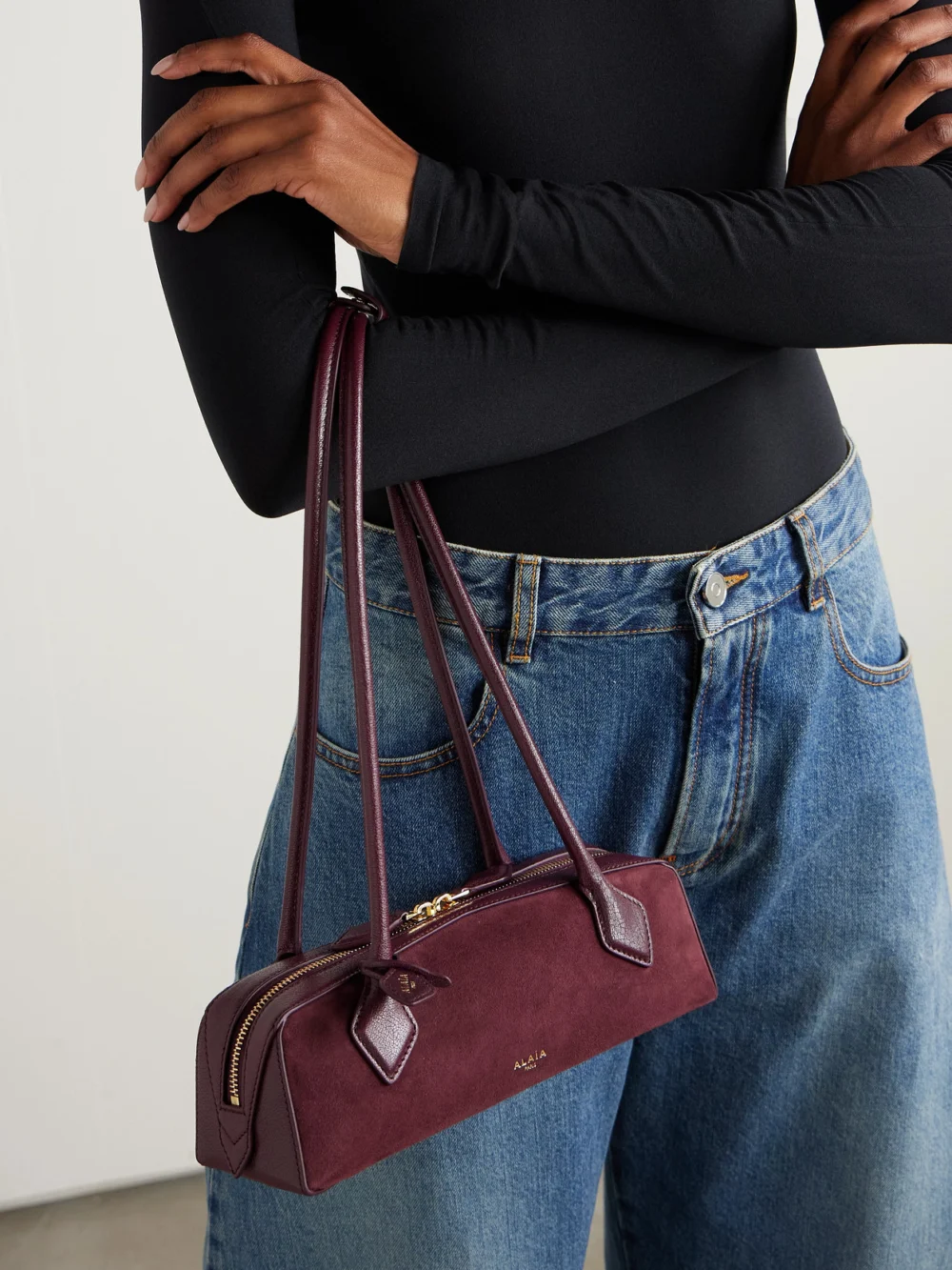 Alaïa Le Teckel Small Leather-trimmed Suede Shoulder Bag, styled view
