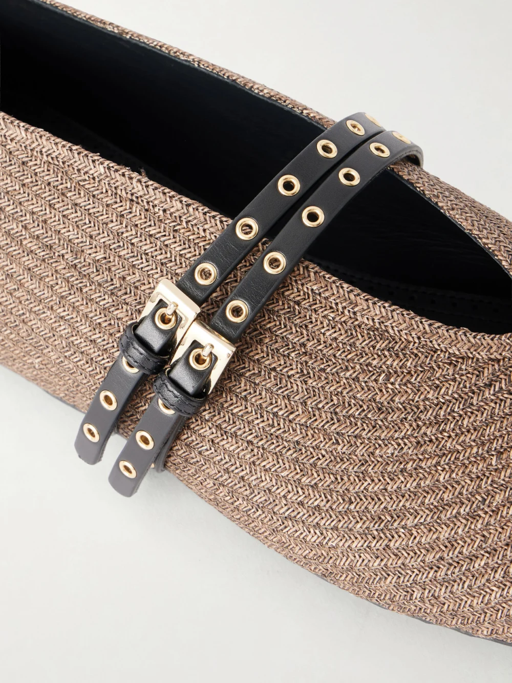 Close-up detail of the Alaïa Leather-trimmed Raffia Ballet Flats