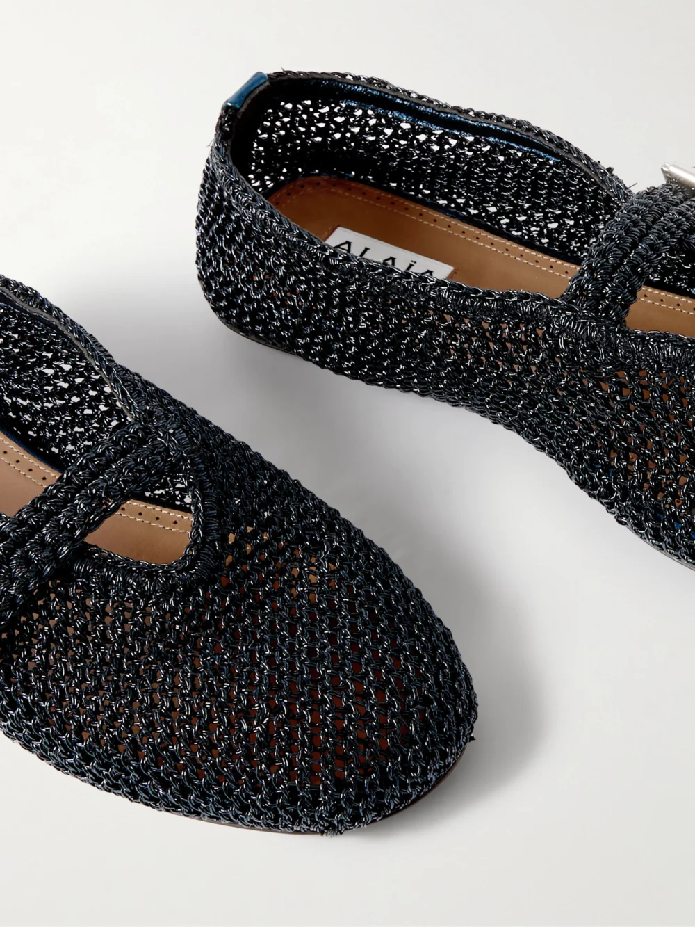 Close-up detail of the Alaïa Metallic Crocheted Ballet Flats