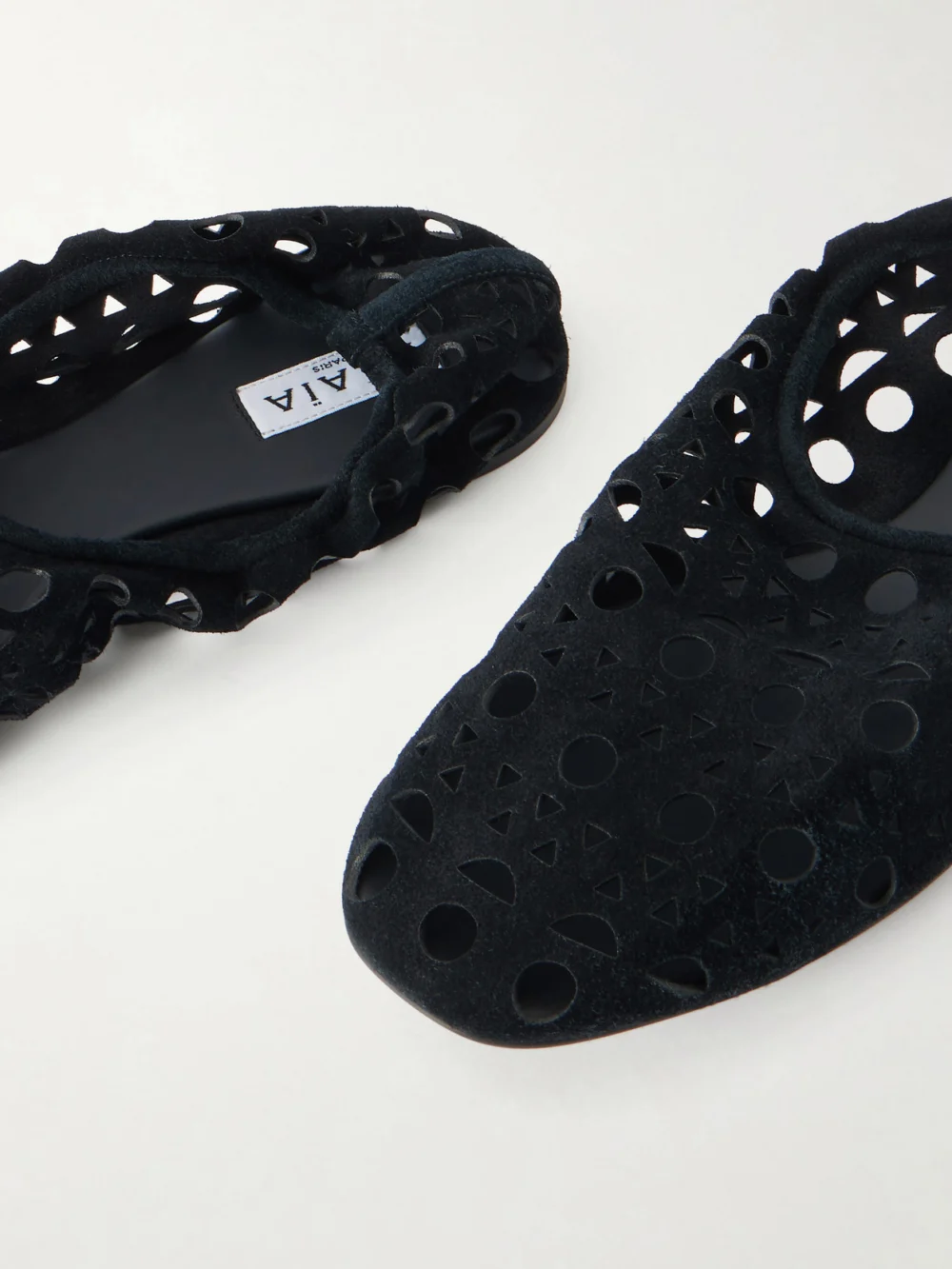 Close-up detail of the Alaïa Neo Vienne Perforated Suede Ballet Flats