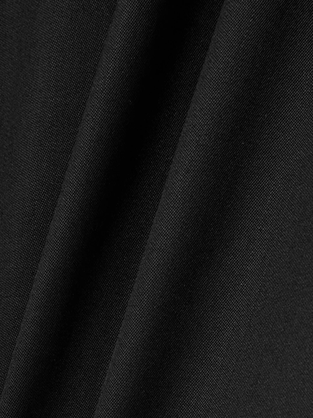 Close-up detail of the Alaïa Open-back Asymmetric Grain De Poudre Wool-blend Jumpsuit