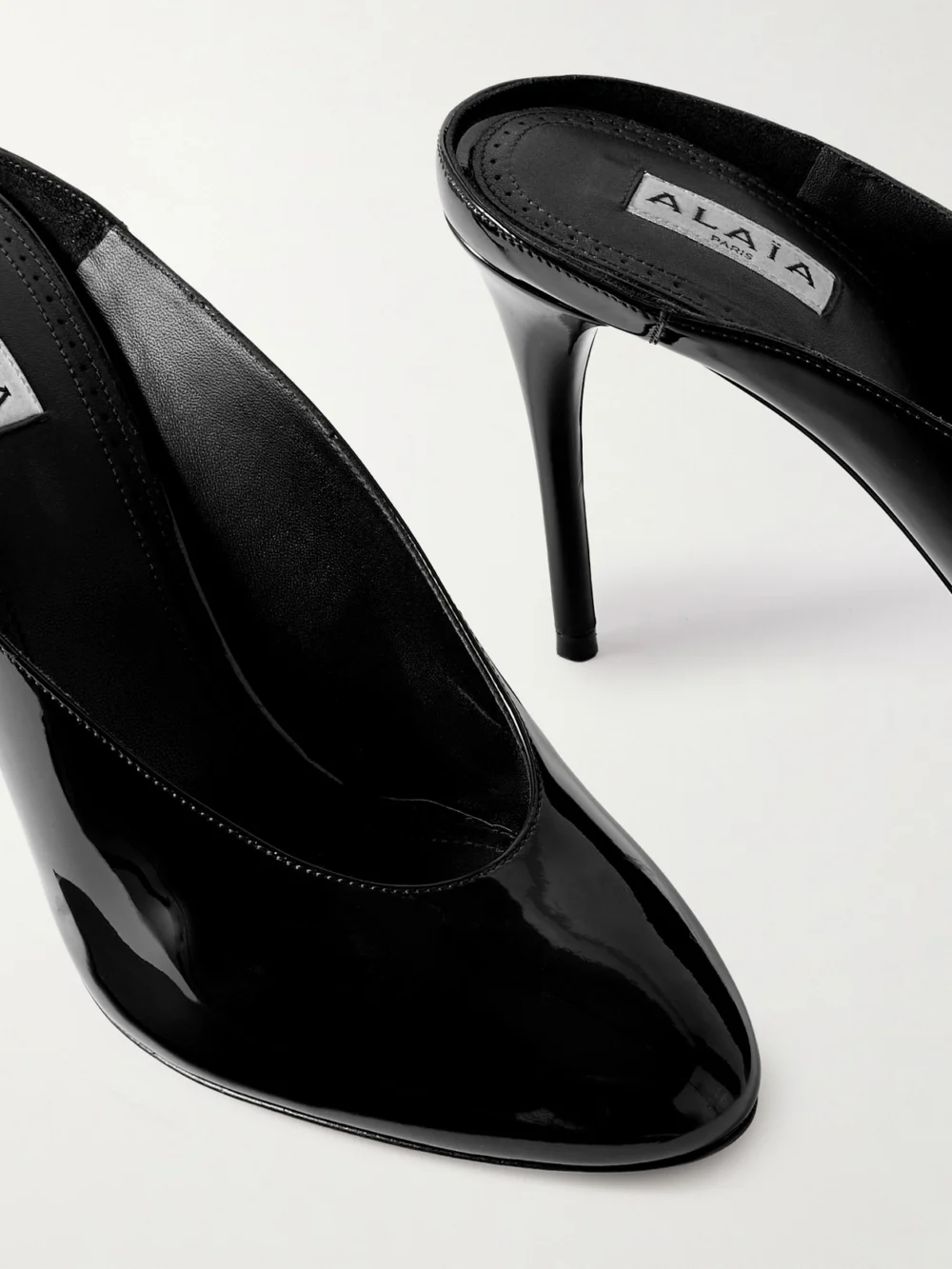 Close-up detail of the Alaïa Patent 90 Leather Mules