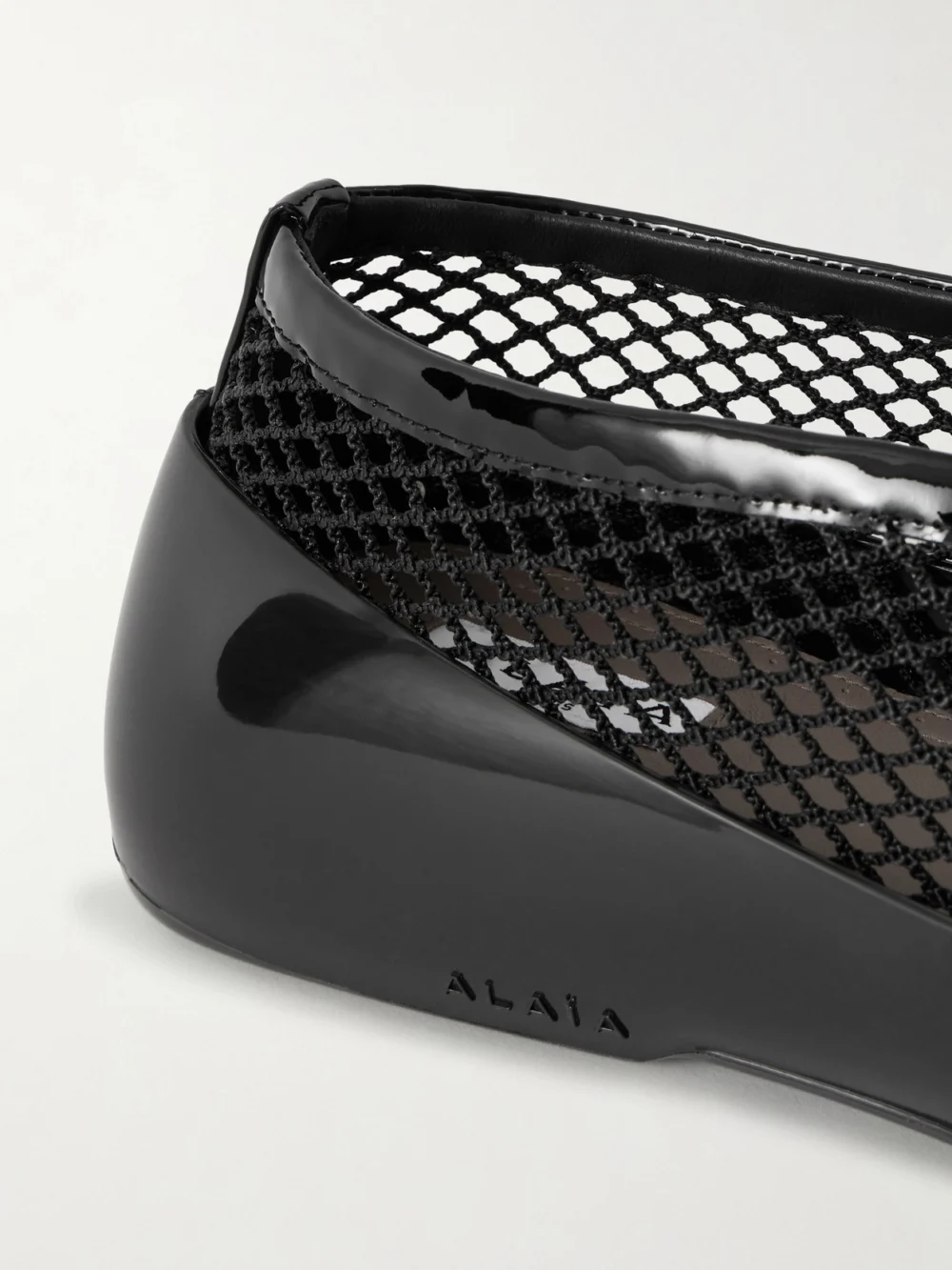 Close-up detail of the Alaïa Patent Leather-trimmed Mesh and Rubber Ballet Flats