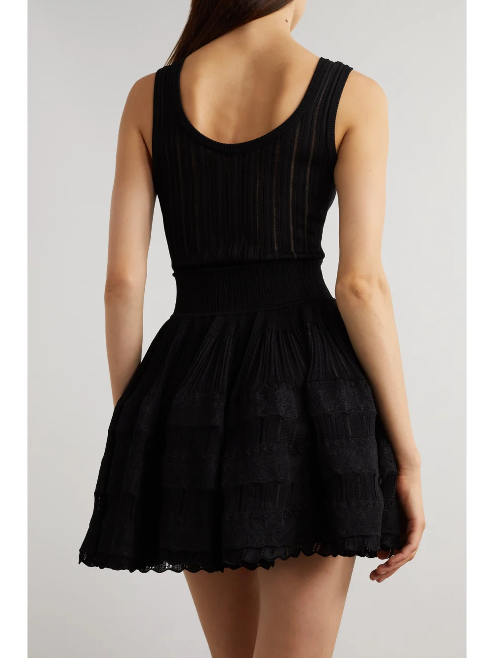 Back view of the Alaïa Ribbed Pointelle-knit Mini Dress