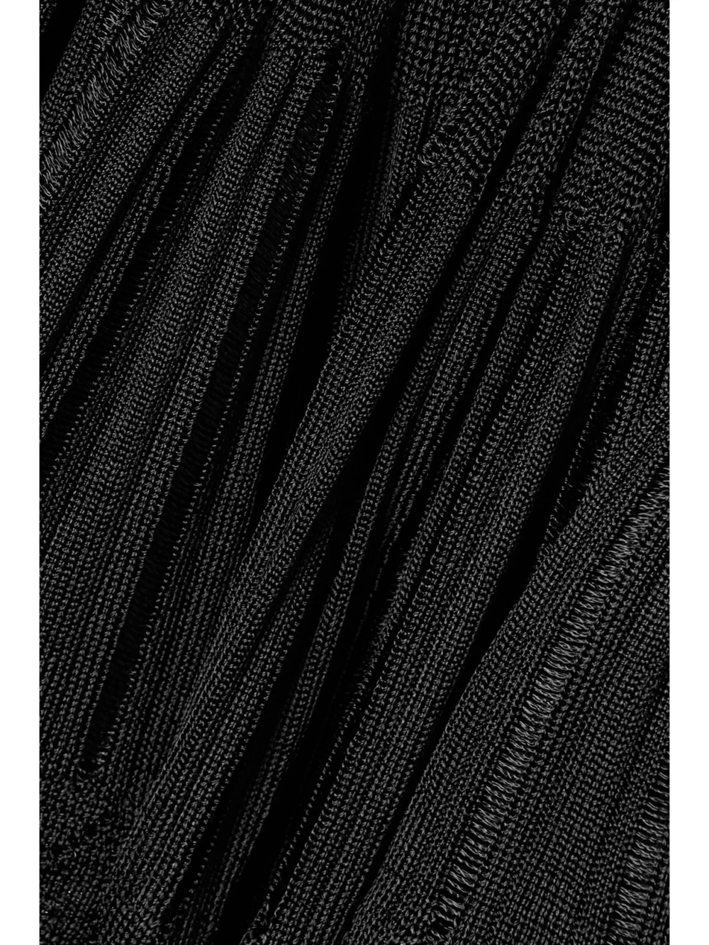 Close-up detail of the Alaïa Ribbed Pointelle-knit Mini Dress