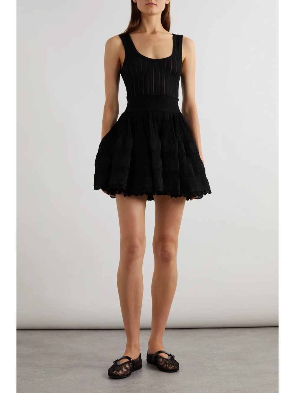 Alaïa Ribbed Pointelle-knit Mini Dress, worn by a model