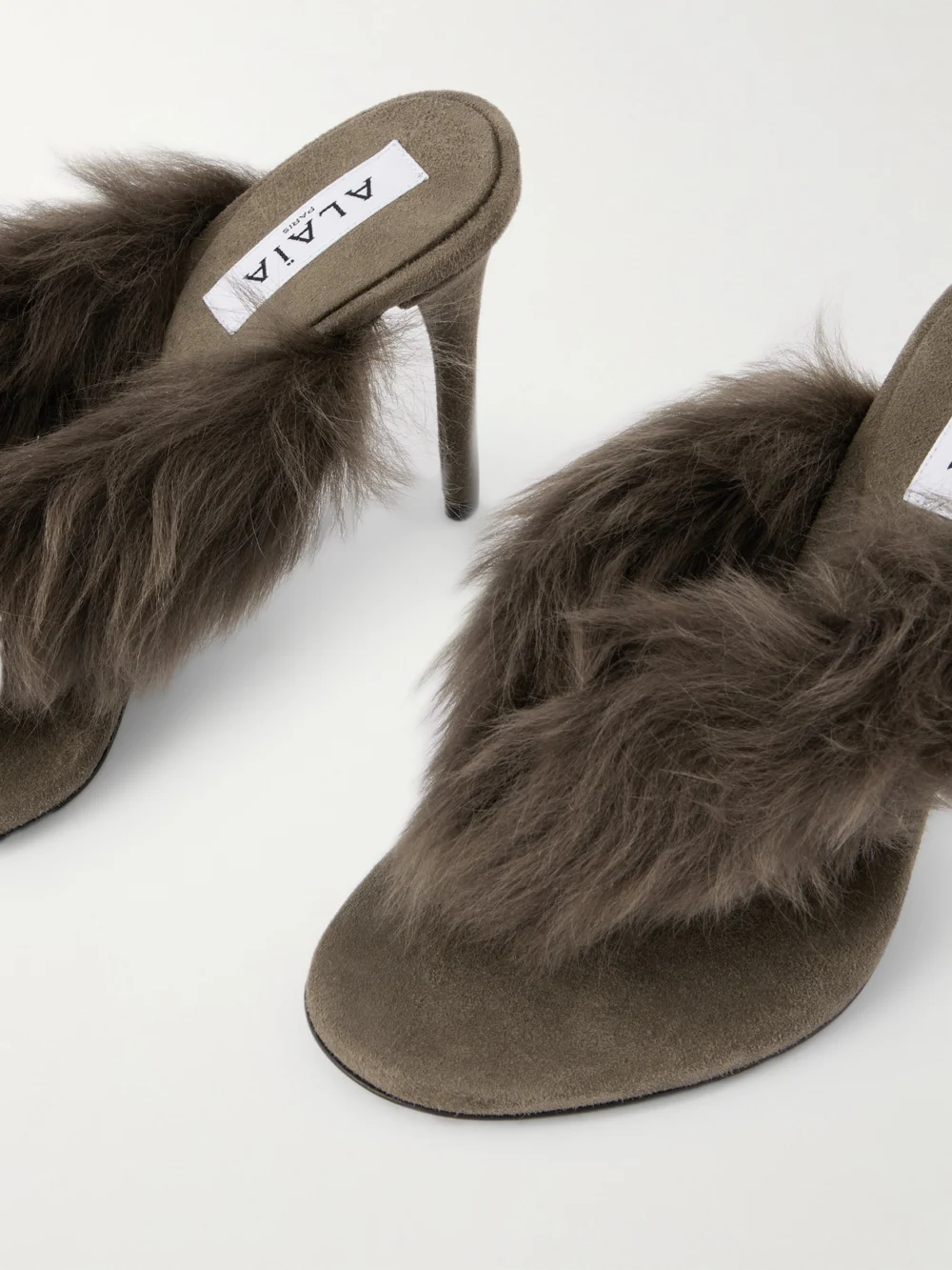 Close-up detail of the Alaïa Shearling Mules