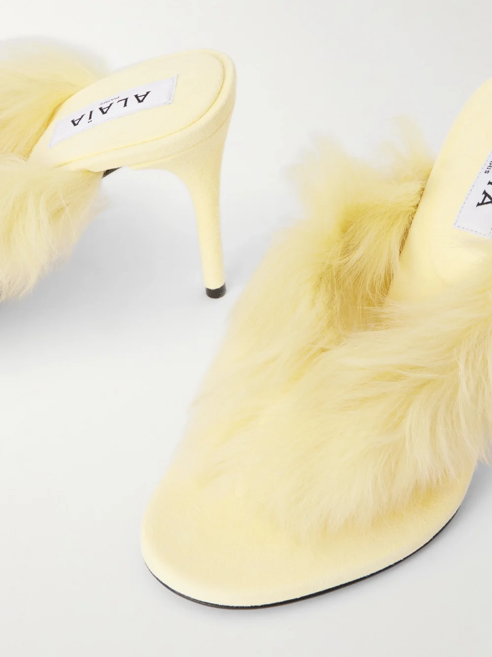 Close-up detail of the Alaïa Shearling Mules