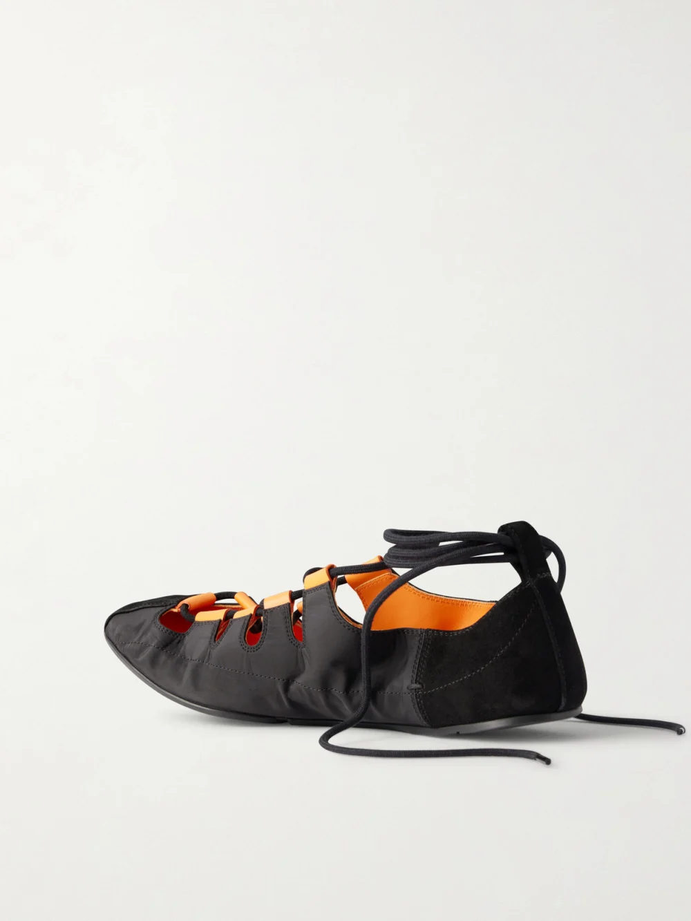 Back view of the Alaïa Suede-trimmed Shell Ballet Flats