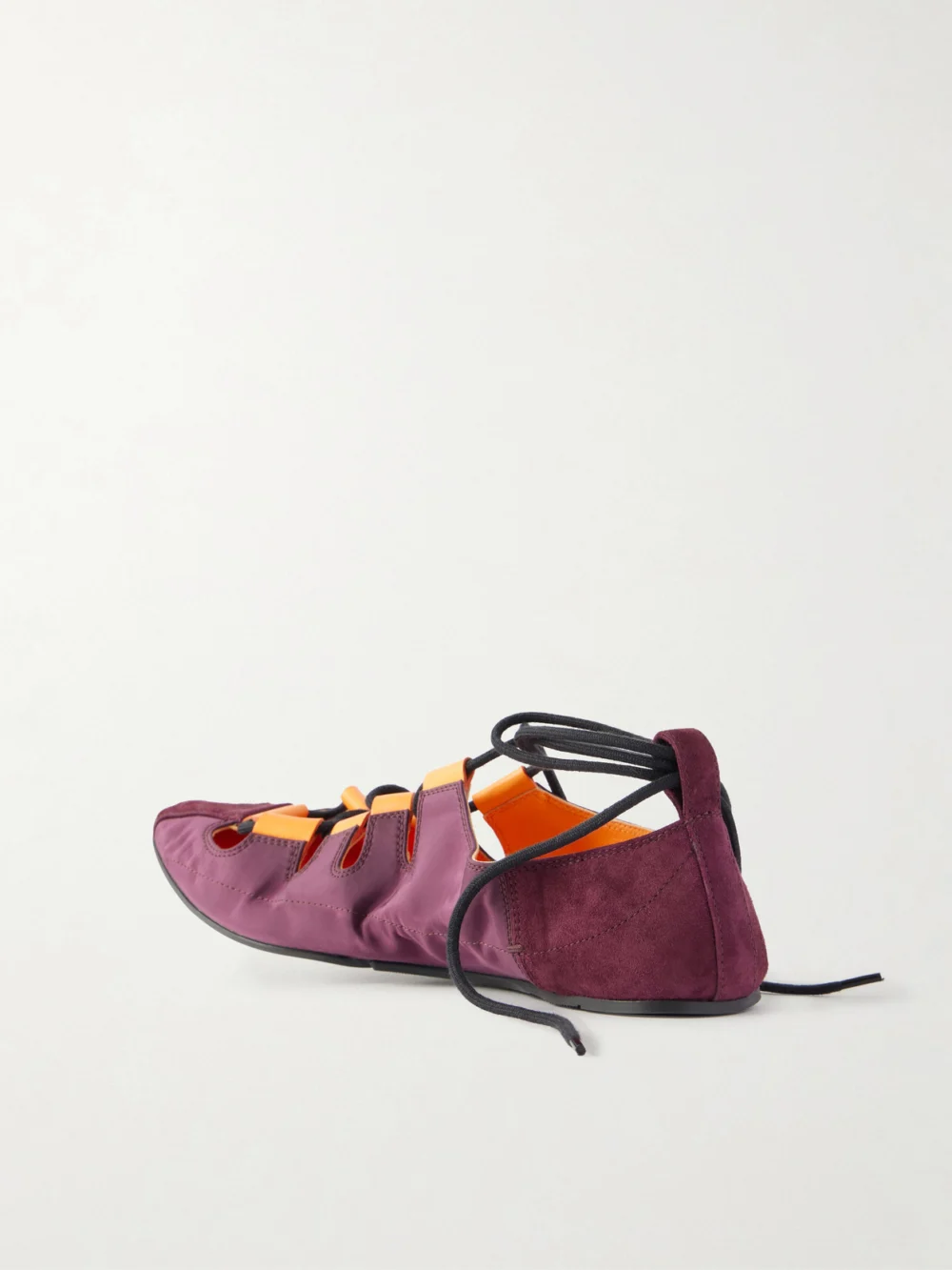 Back view of the Alaïa Suede-trimmed Shell Ballet Flats