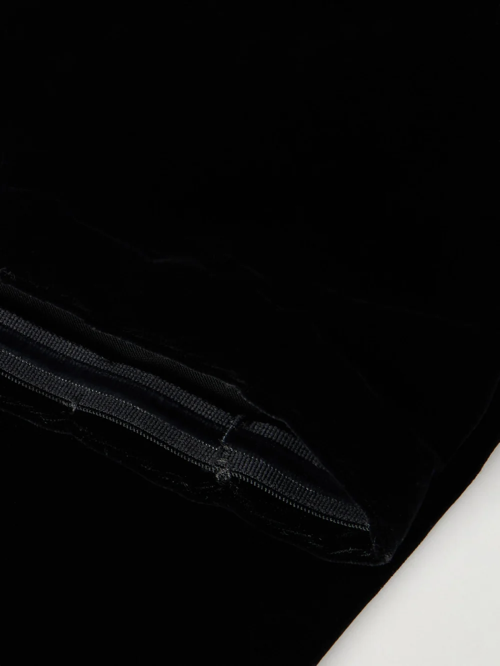 Close-up detail of the Alaïa Velvet Gloves