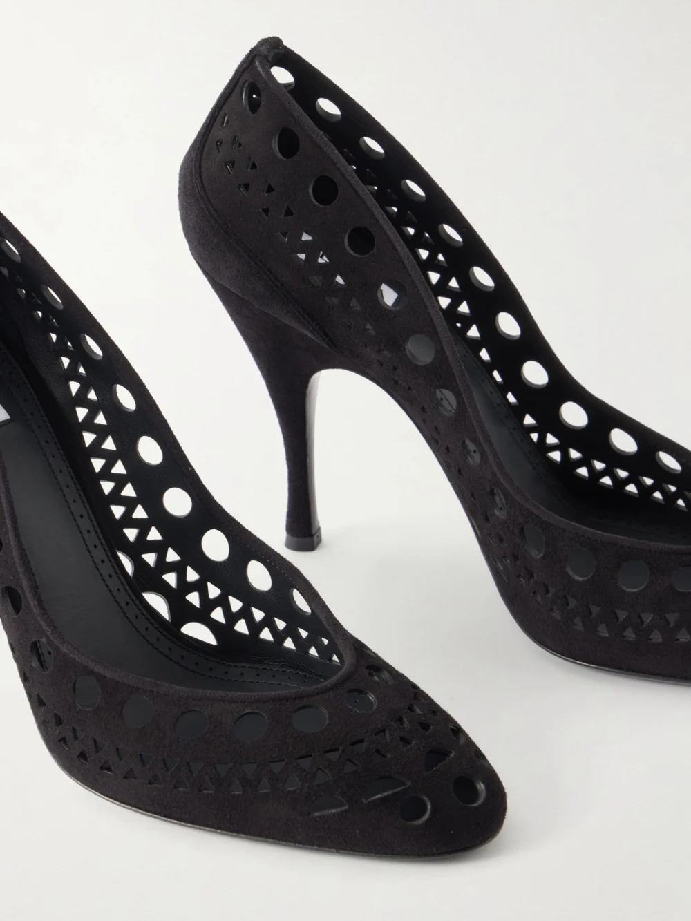 Close-up detail of the Alaïa Vienne 100 Laser-cut Suede Pumps