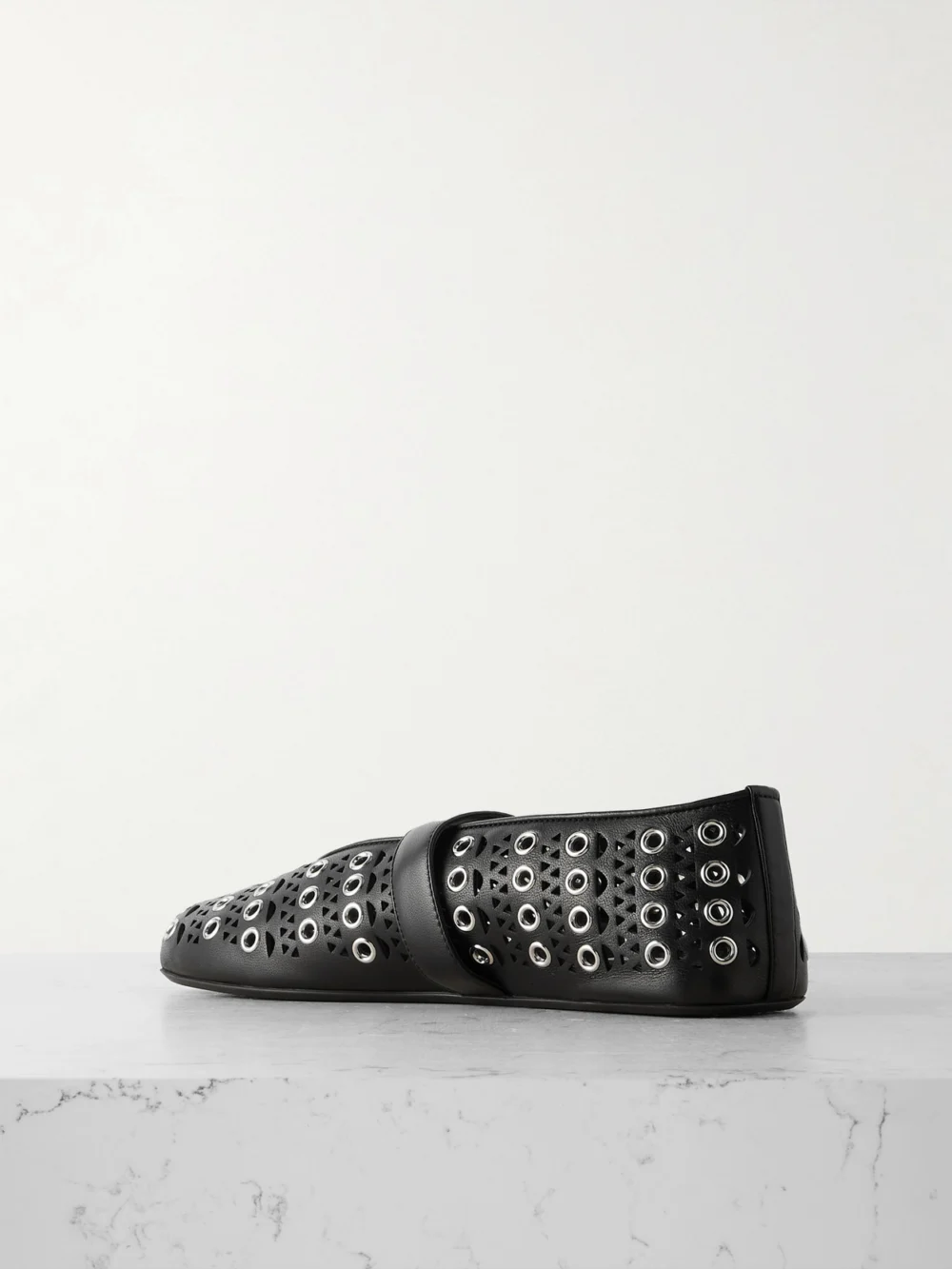 Back view of the Alaïa Vienne Perforated Eyelet-embellished Leather Ballet Flats