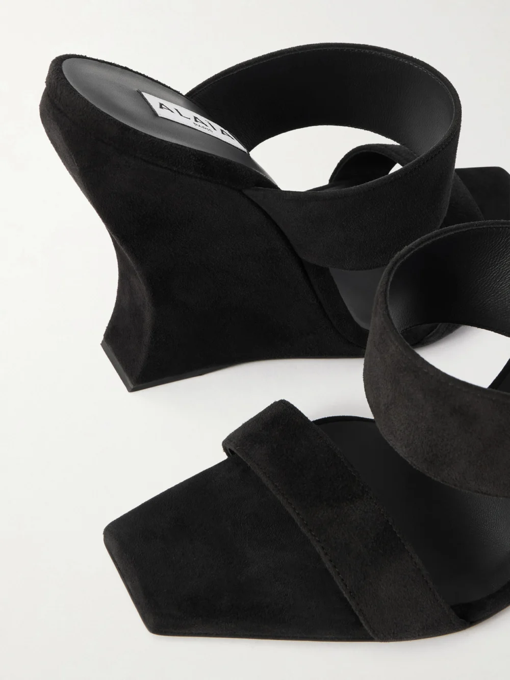 Close-up detail of the Alaïa Wave 110 Suede Wedge Mules