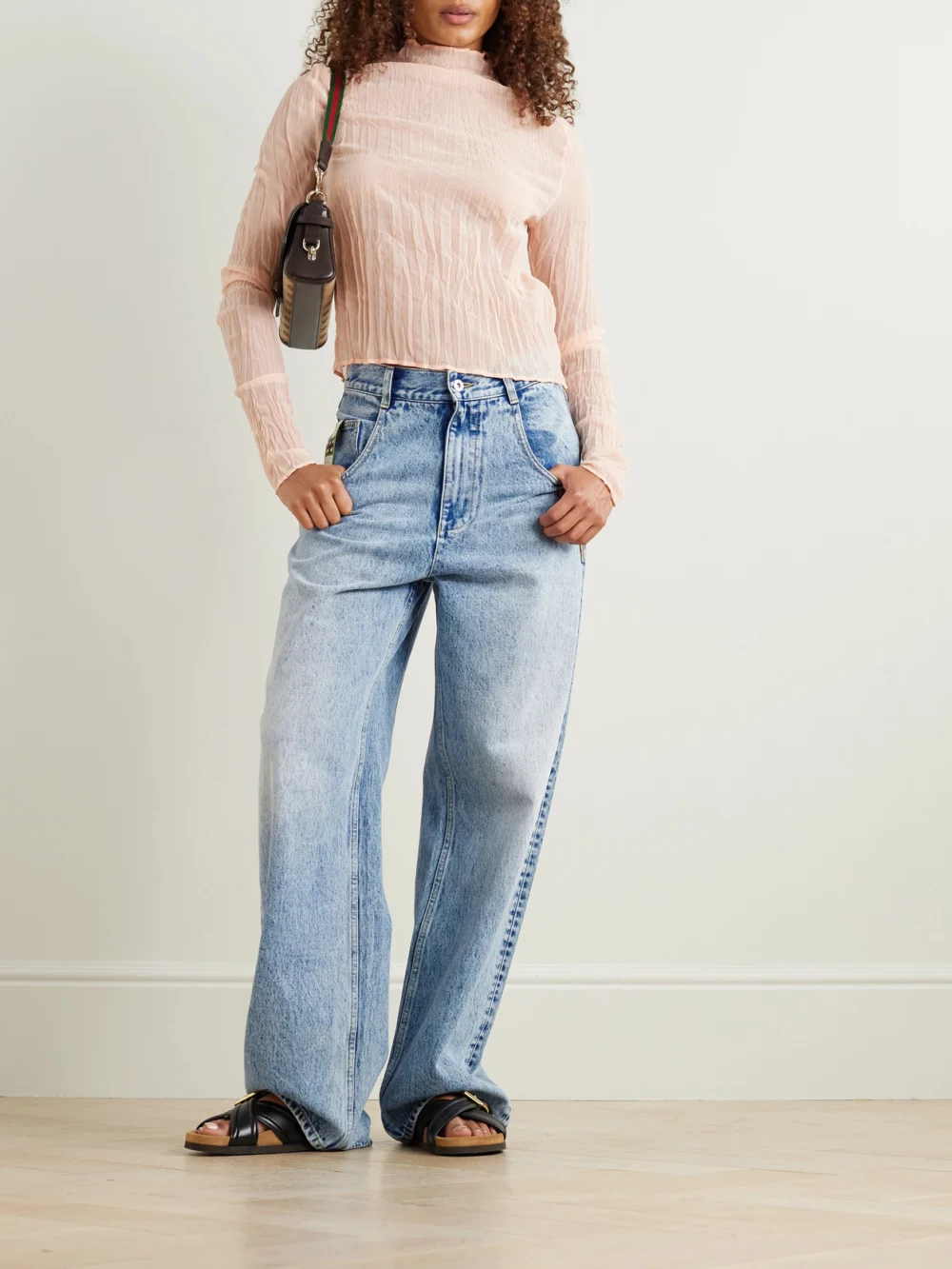 Alémais Jackpot Appliquéd High-rise Straight-leg Jeans, worn by a model