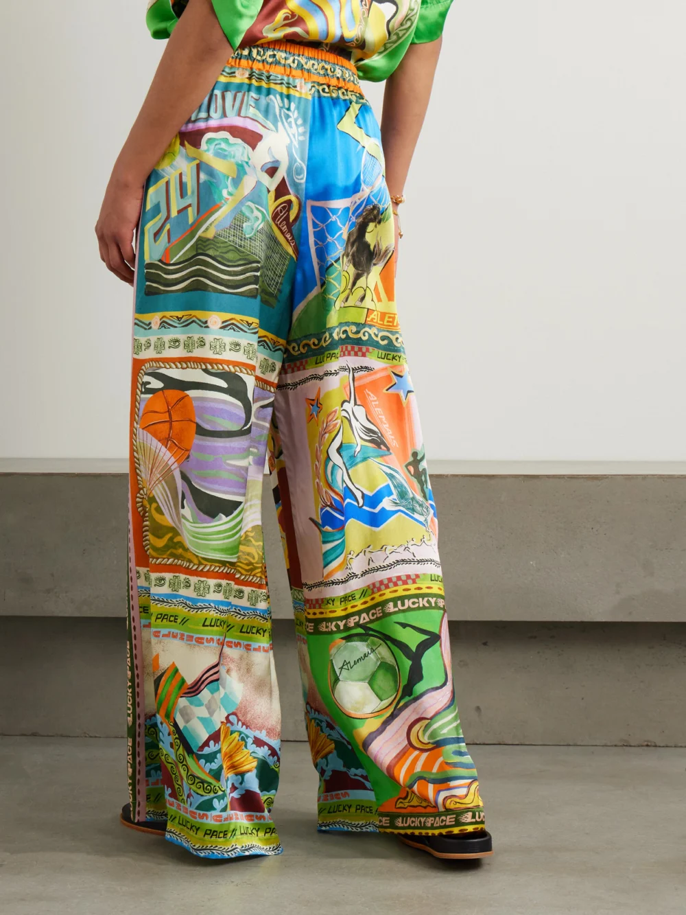Back view of the Alémais Lucky Pace Printed Silk-satin Wide-leg Pants