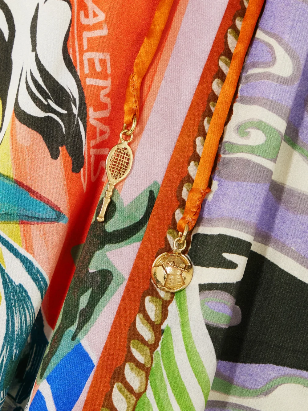 Close-up detail of the Alémais Lucky Pace Printed Silk-satin Wide-leg Pants