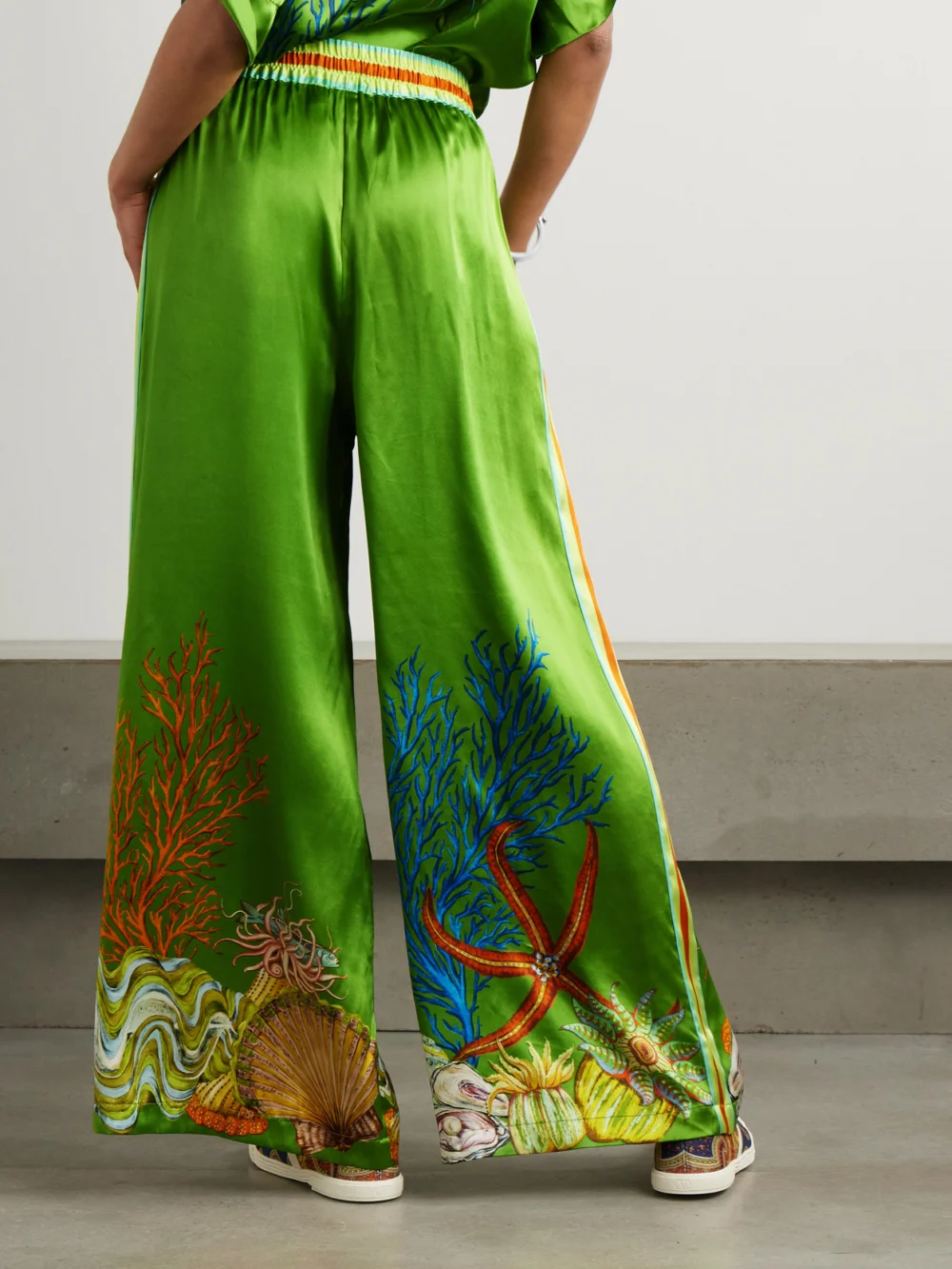 Back view of the Alémais + Sam Pauletto Aquatica Printed Silk-satin Wide-leg Pants
